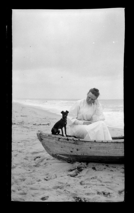 Woman and dog in boat, Sea Girt Marriott C. Morris Collection [P.2013.13.142]